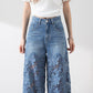 Damen blaue hochtaillierte Jeans mit weitem Bein, Lochmuster und Spitzeneinsätzen
