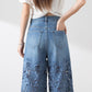 Damen blaue hochtaillierte Jeans mit weitem Bein, Lochmuster und Spitzeneinsätzen